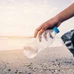 Man-Picking-Up-Trash-On-The-Beach-For-Ocean-Cleanup