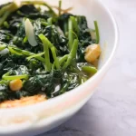 what to serve with scallops includes sauteed spinach as shown here.